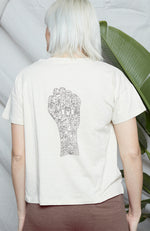 Stone colored classic t shirt fit with printed "Use Your Voice" graphic on front, and fist graphic on back.